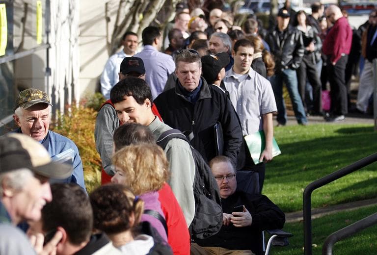 People wait in line during a job fair for Home Depot at the WorkSource Oregon Thursday, Feb. 2, 2012, in Tigard, Ore. (AP)