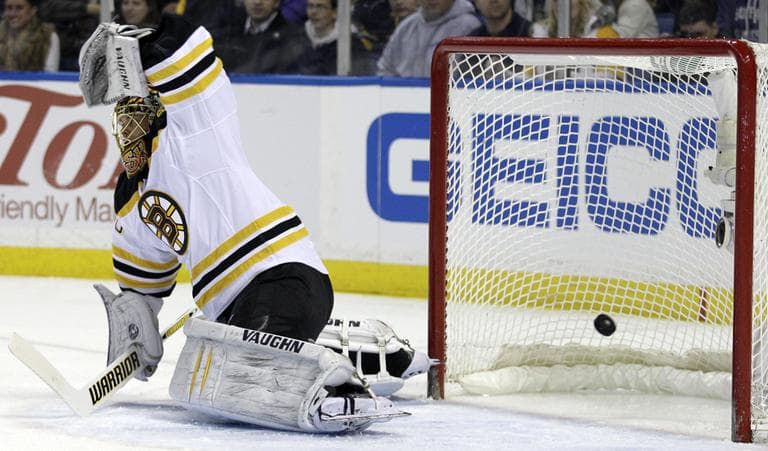 Buffalo Sabres&#039; Christian Ehrhoff scores on Bruins goalie Tuukka Rask, during the first period of an NHL hockey game in Buffalo, N.Y., Wednesday. (AP Photo)