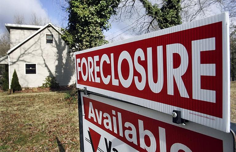 A foreclosure sign is seen on the lawn of a home in Egg Harbor Township, N.J. (AP)