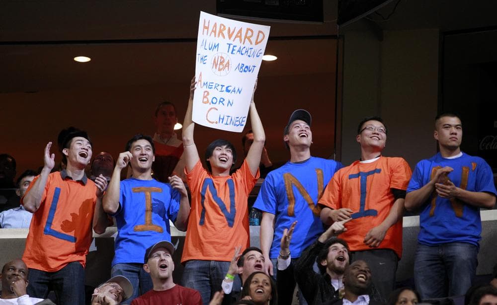 Fans cheer for New York Knicks point guard Jeremy Lin during the second half of an NBA basketball game against the Washington Wizards, Wednesday in Washington. (AP)