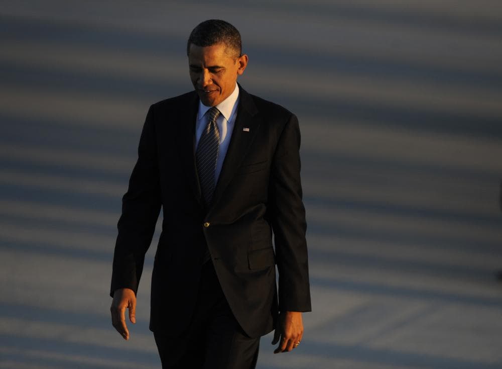 President Barack Obama walks off Air Force One in Chicago. (AP)