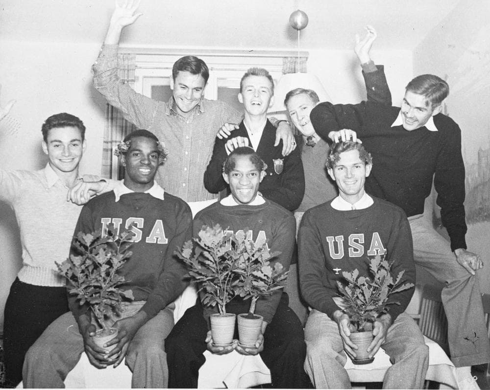 Members of the US delegation congratulate the first American gold medalists of the 1936 Olympics. Marty Glickman (far left) and Jesse Owens (seated, left) are two of the principle characters in the play &quot;Olympics Uber Alles.&quot; (AP)