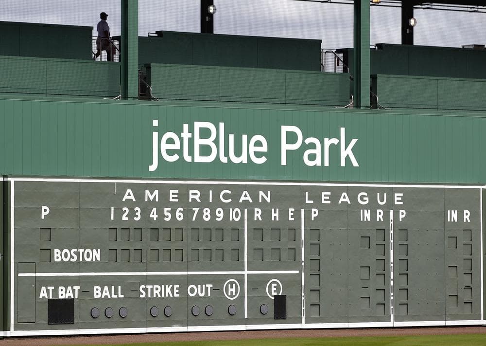 A restored manual scoreboard once used at Fenway Park for almost three decades now decorates the outfield wall of the Red Sox&#039;s new spring training baseball stadium in Fort Myers, Fla. (AP)