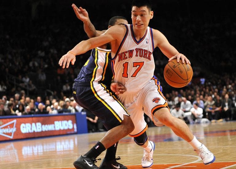 New York Knicks' point guard Jeremy Lin (17) drives the ball against Utah Jazz's point guard Earl Watson (11) during an NBA basketball game on Monday, Feb. 6, 2012, in New York. (AP)
