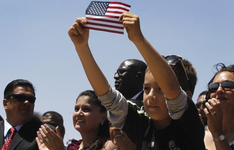 In this May 10, 2011, file photo audience members listen to President Barack Obama speak about immigration reform at Chamizal National Memorial Park in El Paso, Texas. A year before the 2012 presidential election, Hispanic voters face a choice: continue to support Obama despite being disproportionately hurt by the economic downturn or turn to Republicans at a time when many GOP presidential hopefuls have taken a hard line on immigration. (AP)