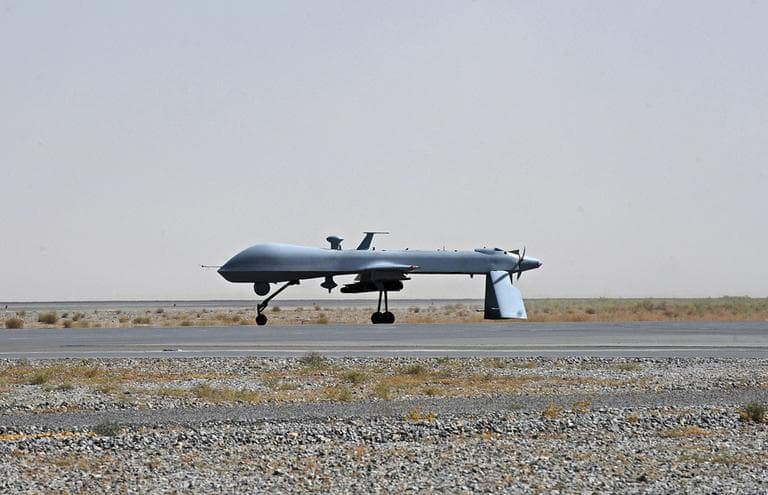 A U.S. Predator unmanned drone armed with a missile stands on the tarmac of Kandahar military airport in Afghanistan in June 2010. (AP)