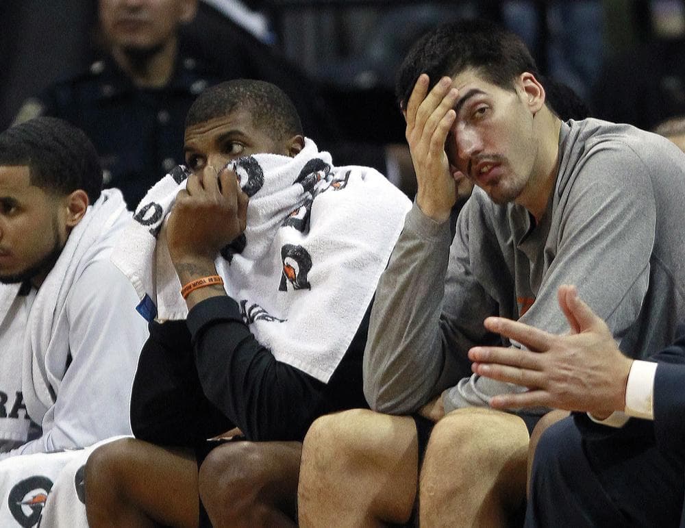 Byron Mullens (right) can hardly bear to watch as the Bobcats suffer yet another loss. (AP)