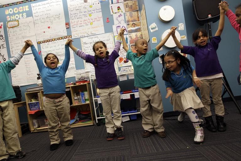 In this April 13, 2011 photo, children take part in a music class at the Mott Haven Academy Charter School, in the Bronx borough of New York. (AP)