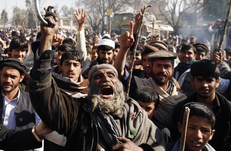 Afghans shout anti-US slogans during a demonstration in Mehterlam, Laghman province east of Kabul, Afghanistan, Thursday, Feb. 23, 2012. Afghan police on Thursday fired shots in the air to disperse hundreds of protesters who tried to break into an American military base in the country's east to vent their anger over this week's Quran burnings incident. (AP)