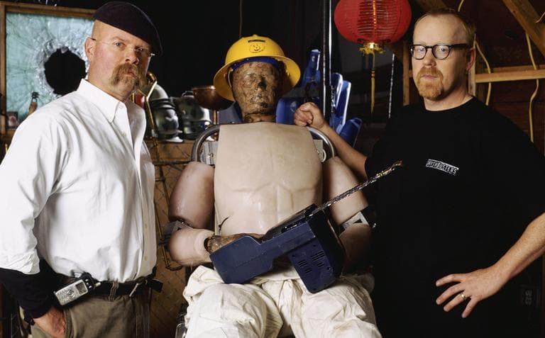 Jamie Hyneman, left, &quot;Buster&quot; the crash-test dummy and Adam Savage, right, during a segment of the Discovery Channel's show &quot;Mythbusters.&quot; (AP)