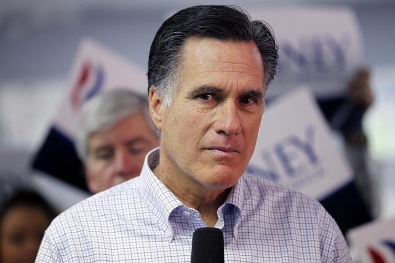 Former Massachusetts Gov. Mitt Romney, listens to a question from a reporter as he visits a campaign call center in Livonia, Mich., on Tuesday. 