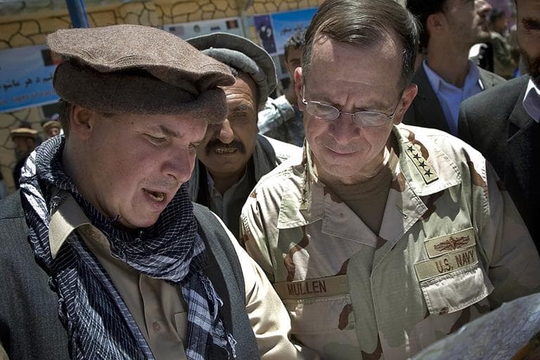 Greg Mortenson shows the locations of future village schools to U.S. Navy Adm. Mike Mullen, chairman of the Joint Chiefs of Staff in Panjshir Valley, Afghanistan in 2009. (AP/Department of Defense)