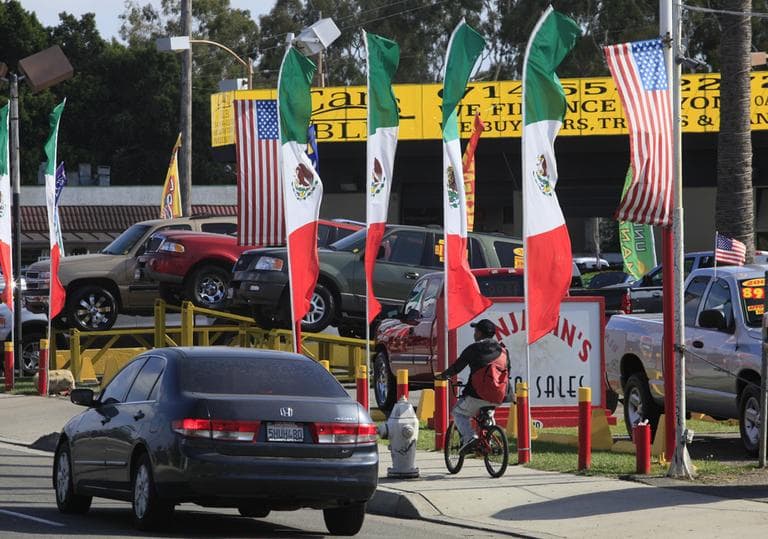 American and Mexican flags decorate an auto shop in Santa Ana, Calif. (AP)
