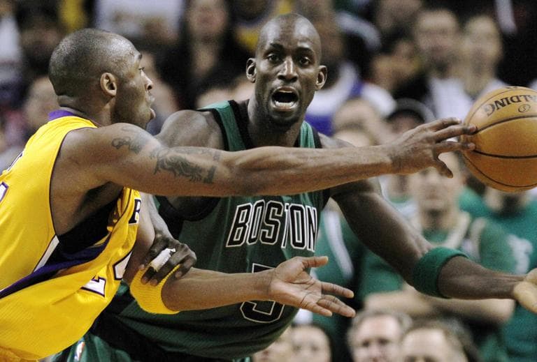 Boston Celtics forward Kevin Garnett, right, defends Los Angeles Lakers guard Kobe Bryant on a drive to the basket during the second quarter of an NBA basketball game in Boston, Thursday. (AP)