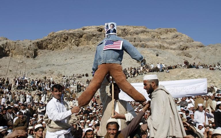 Afghans display an effigy of the US President Barack Obama during anti-US protest over burning of Qurans at a military bass in Afghanistan, in Ghani Khail, east of Kabul Friday, Feb. 24,2012. (AP)