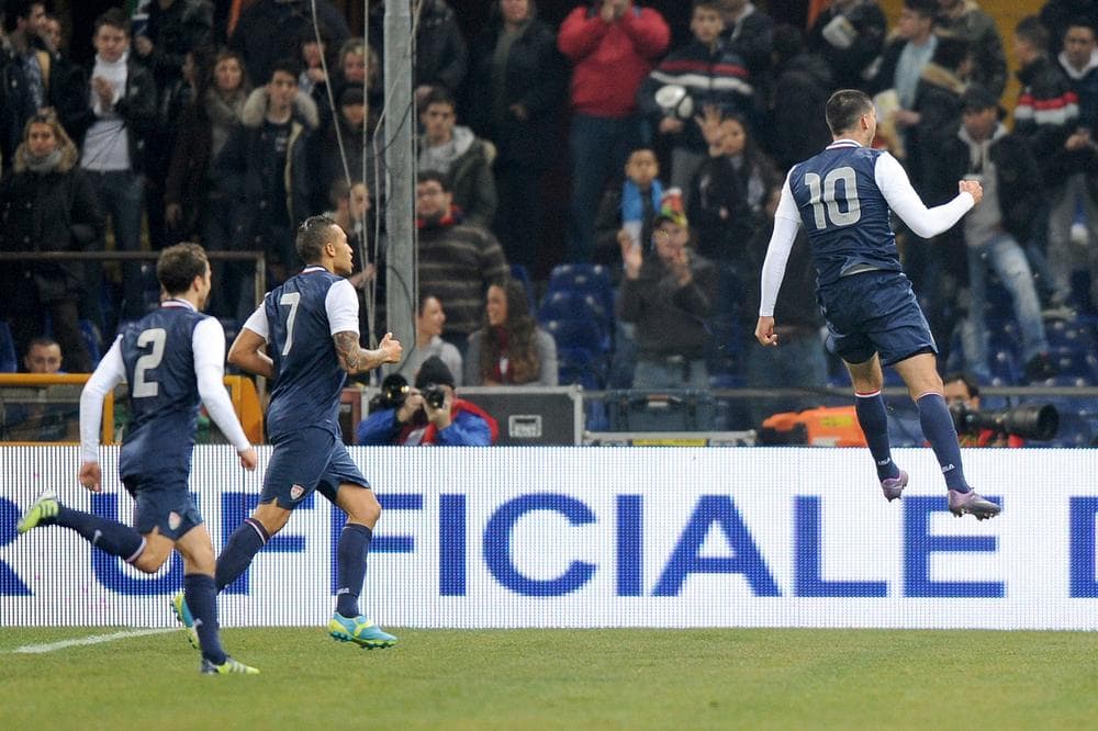 US midfielder Clint Dempsey, right, celebrates with teammates after scoring during a friendly soccer match between Italy and USA. (AP)