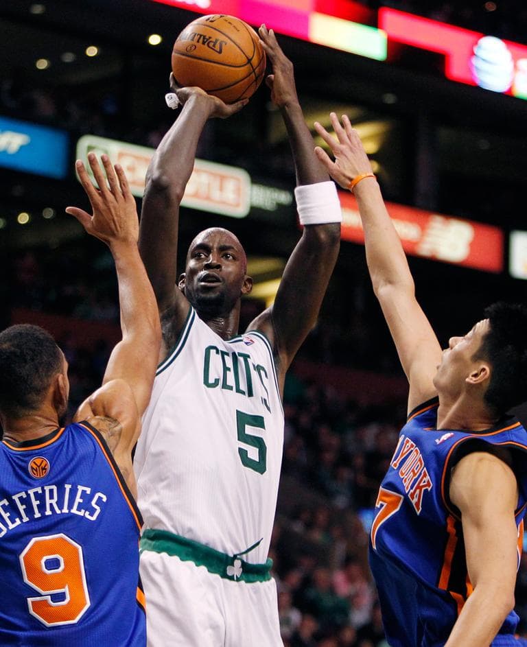 Celtics' Kevin Garnett shoots over New York Knicks' Jared Jeffries and Jeremy Lin. (Michael Dwyer/AP)
