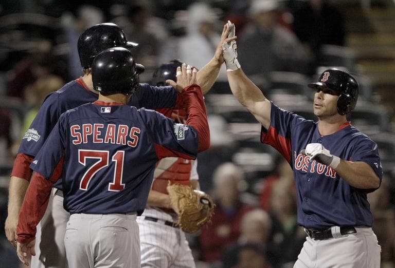 Boston Red Sox&#039;s Daniel Butler is high-fived by teammates Lars Anderson and Nate Spears after the three scored on Butler&#039;s home run during the seventh inning of a spring training baseball game against the Minnesota Twins on Monday in Fort Myers, Fla. (AP)