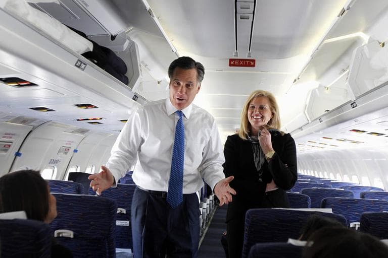 Republican presidential candidate, former Massachusetts Gov. Mitt Romney, and his wife Ann, talk to reporters on his campaign plane before taking off for Boston, in Columbus, Ohio, Tuesday, March 6. (AP)