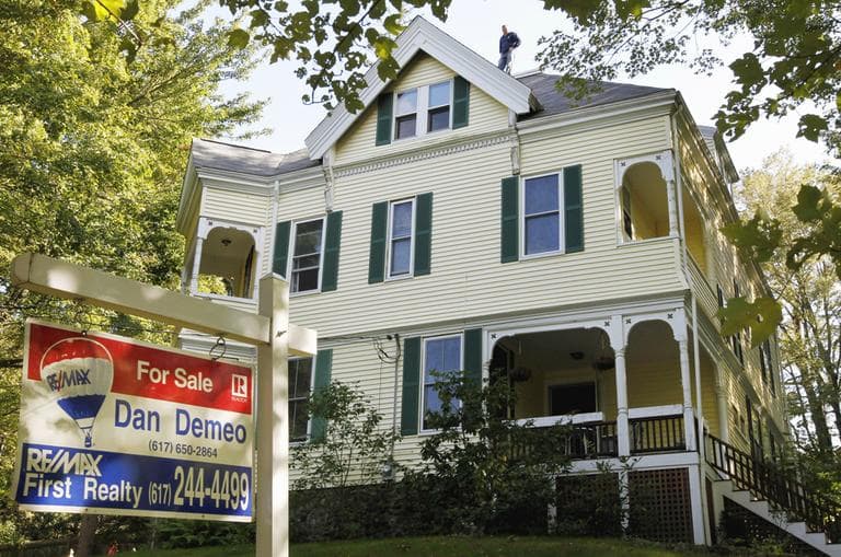 In this Sept. 19, 2011 file photo, a house with a &quot;for sale&quot; sign in front is seen in Newton, Mass. Home ownership over the past decade posted the biggest drop since the Great Depression as layoffs, foreclosures and the mortgage mess made it harder for people to buy or hold onto their homes. (AP)