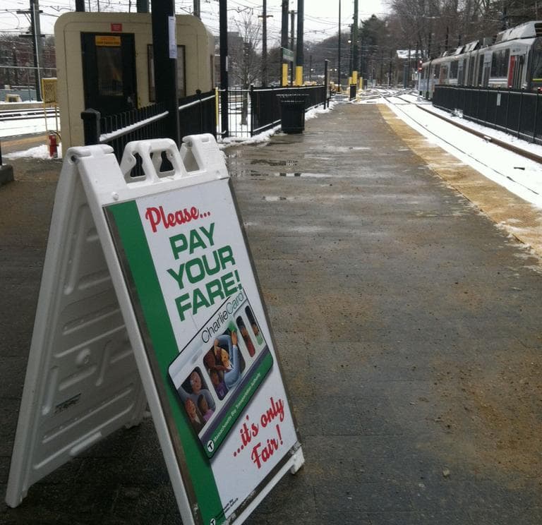 &quot;Pay your fare... it's only fair!&quot; Signs like this hope to discourage fare evaders on the T. (Beenish Ahmed for WBUR)