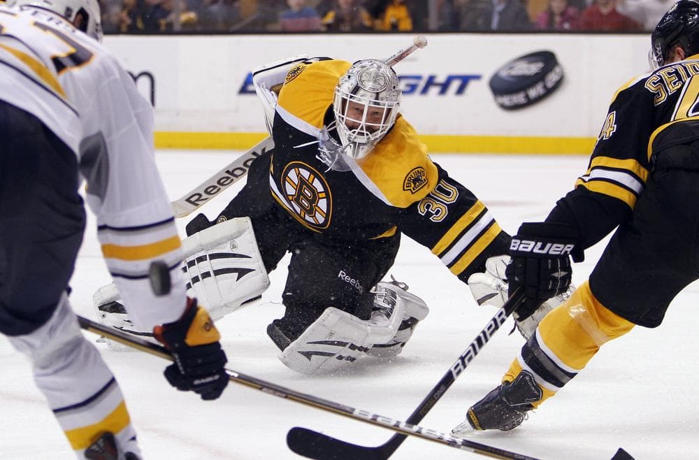 Bruins goalie Tim Thomas watches as the puck deflects behind Sabres&#039; Tyler Myers as Bruins&#039; Dennis Seidenberg defends in the third period of last night&#039;s home game. (AP Photo)