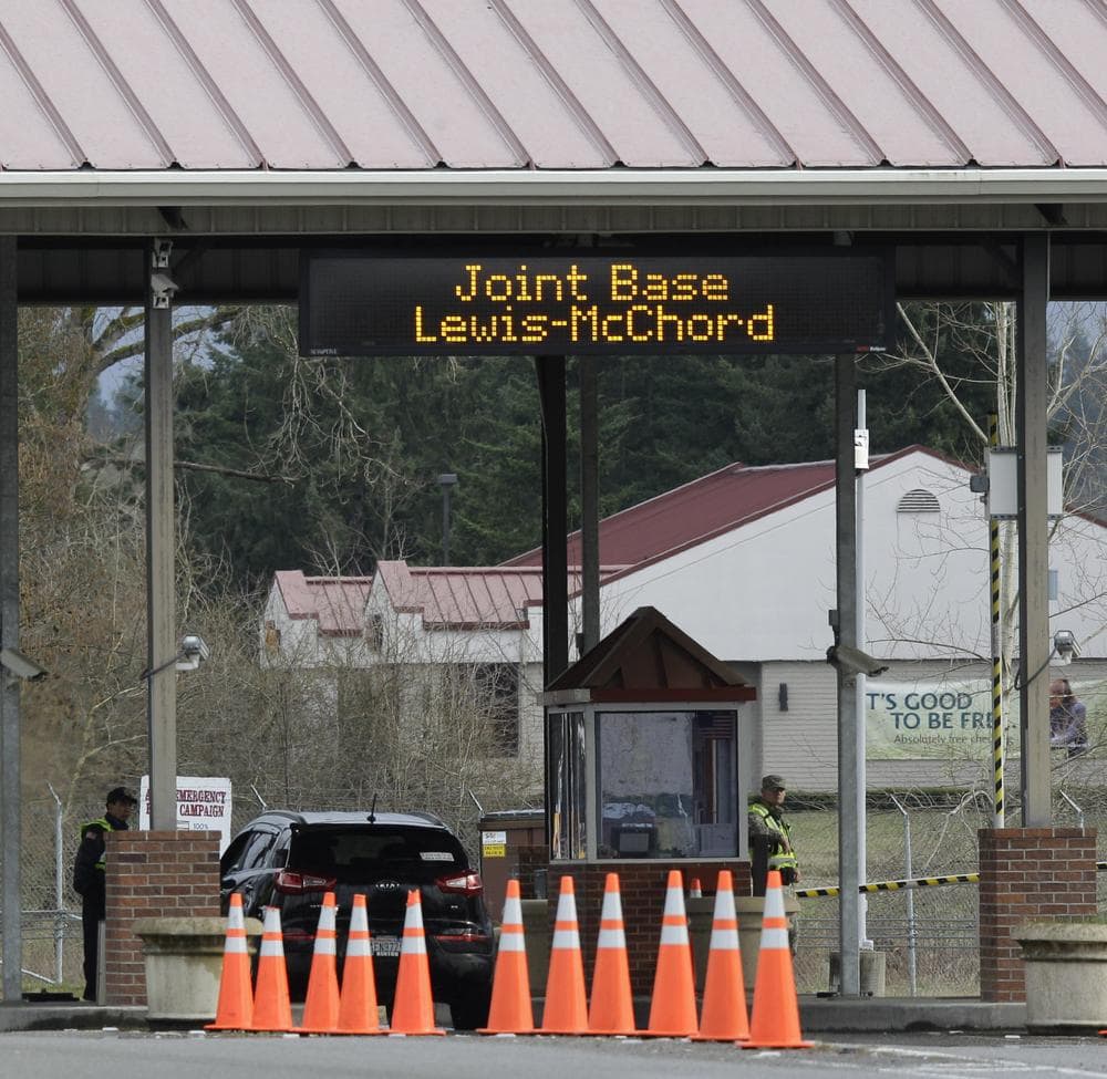 A guarded gate at Joint Base Lewis McChord is shown Sunday. (AP)