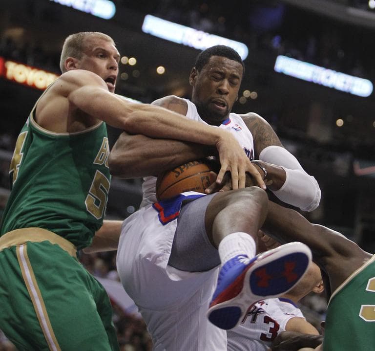 Celtics center Greg Stiemsma battles DeAndre Jordan for a rebound in the first half of an NBA basketball game in Los Angeles on Monday.  (AP)