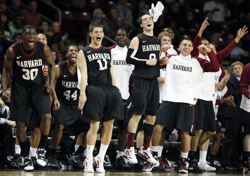 Harvard&#039;s Kyle Casey (30), Keith Wright (44), Oliver McNally (11), Laurent Rivard (0) and teammates react after a Crimson 3-pointer against Boston College late in the second half in Boston on Dec. 29, 2011. Harvard won 67-46. (AP)
