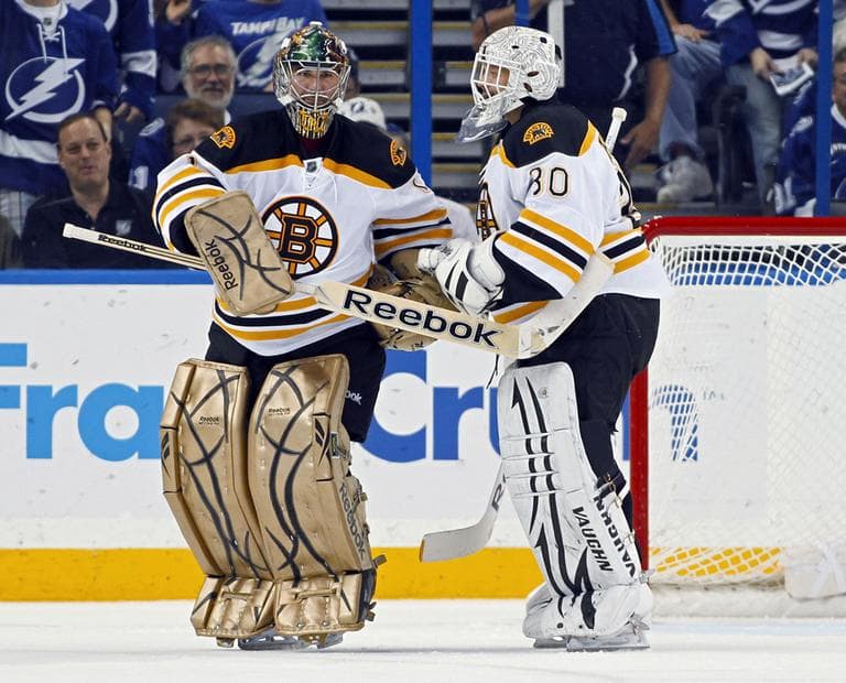 Bruins goalie Marty Turco, left, is replaced in goal by Tim Thomas during the first period against the Tampa Bay Lightning on Tuesday. (AP)