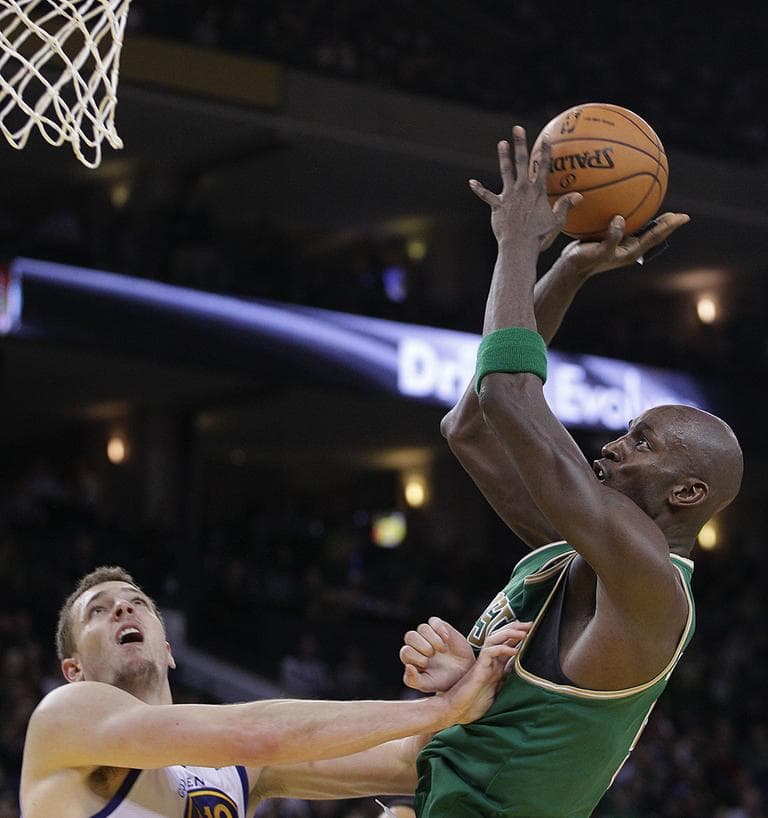 Kevin Garnett shoots over Golden State Warriors' David Lee during the second half, Wednesday. (AP Photo)
