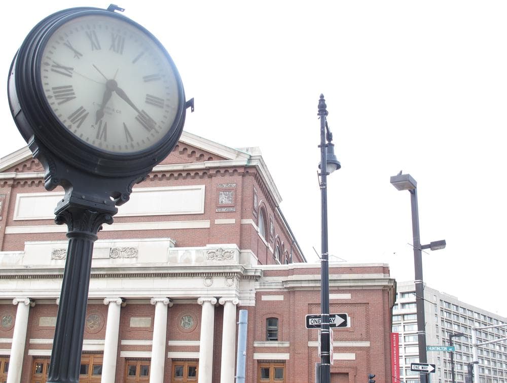 A clock in front of the Boston Symphony Orchestra stopped since the power went out Tuesday night. (Andrea Shea/WBUR)