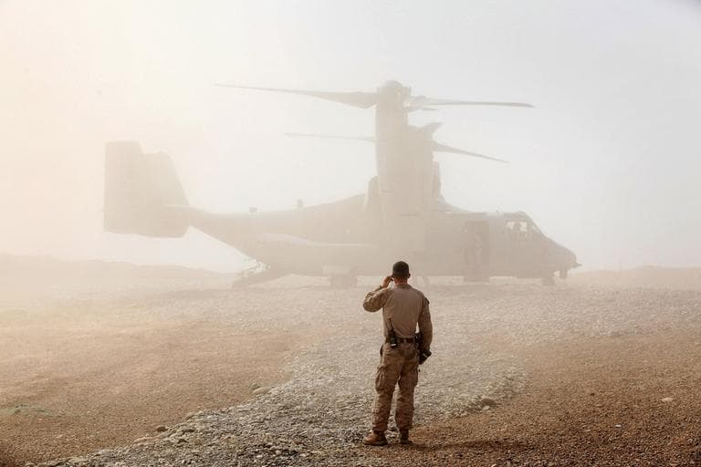 A U.S. Marine watches as an Osprey carrying Defense Secretary Leon Panetta arrives at Forward Operating Base Shukvani, Afghanistan, Wednesday, march 14, 2012. Panetta is scheduled to meet with President Karzai during his two-day visit to Afghanistan. (AP)