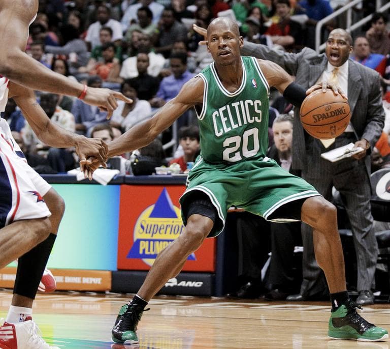 Ray Allen handles the ball before hitting a 3-pointer in front of Atlanta Hawks&#039; Jeff Teague and Tracy McGrady during the third quarter of an NBA basketball game Monday in Atlanta. (AP)