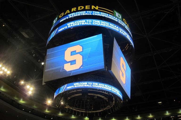 The Syracuse logo lights the Jumbotron at the T.D. Garden in Boston as the team practices for its game against Wisconsin. (Doug Tribou/WBUR)