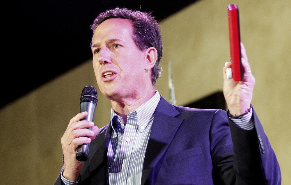Republican presidential candidate, former Pennsylvania Sen. Rick Santorum holds an Etch A Sketch during a rally in Mandeville, La., Wednesday. (AP)