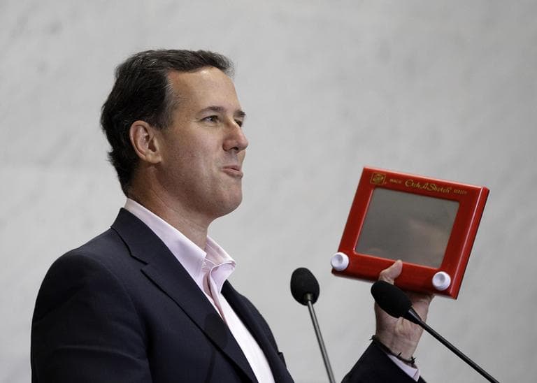 Republican presidential candidate, former Pennsylvania Sen. Rick Santorum holds an Etch A Sketch as he speaks to USAA employees during a campaign stop, Thursday, March 22, 2012, in San Antonio. (AP)