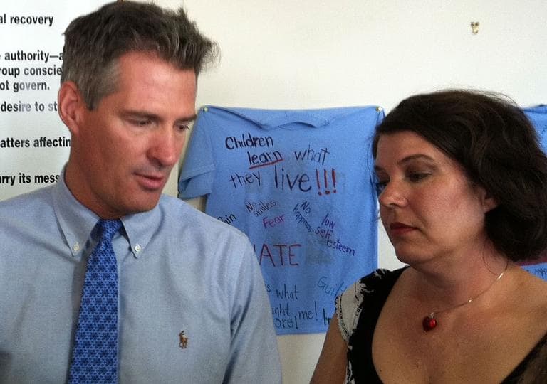 Sen. Scott Brown and his younger sister, Lee Ann Riley, speak to reporters about growing up with abusive stepfathers. (Fred Thys/WBUR)