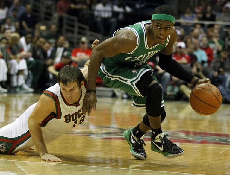 Boston Celtics&#039; Rajon Rondo drives past the Bucks&#039; Beno Udrih during the first half of an NBA basketball game on Thursday in Milwaukee. (AP)