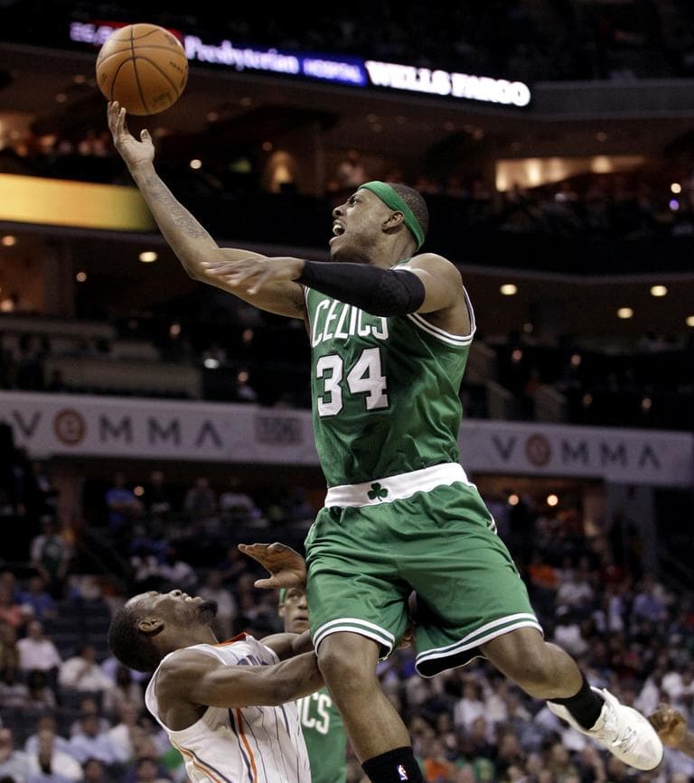 Boston Celtics&#039; Paul Pierce drives over Charlotte Bobcats&#039; Kemba Walker in the second half of an NBA basketball game in Charlotte, N.C., Monday. (AP)