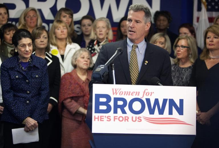 Sen. Scott Brown speaks during a news conference at his campaign headquarters in Boston, as Sen. Olympia Snowe, left, and his wife Gail Huff, right, look on, Monday. (AP)