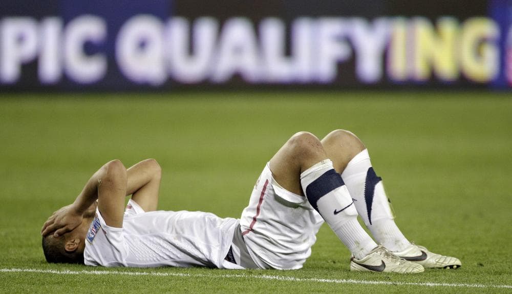 Terrence Boyd can't bear to watch after the US tied El Salvador, eliminating them from 2012 Olympic Qualifying. (AP)