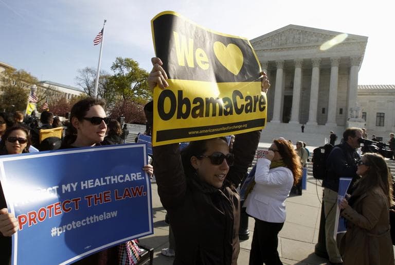 Supporters of health care reform rally in front of the Supreme Court in Washington, Wednesday (AP)