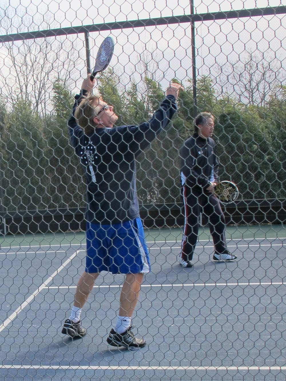 Smaller courts and the ability to play the ball off the cage make for long rallies. (Doug Tribou/Only A Game)