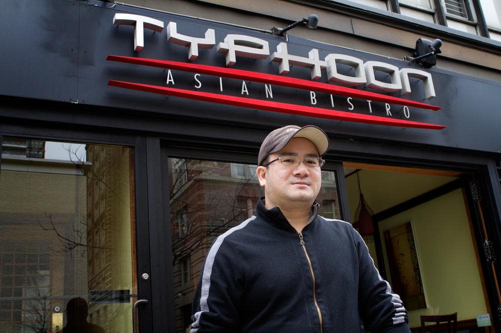 Despite getting a generator Wednesday, Danny Phen of Typoon Asian Bistro on Boylston Street was expecting to lose more money. (Jesse Costa/WBUR)