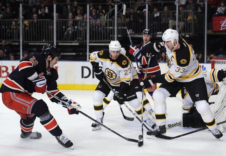 Boston Bruins&#039; Zdeno Chara and Chris Kelly defend against New York Rangers&#039; Brian Boyle in the second period on Sunday. (AP)