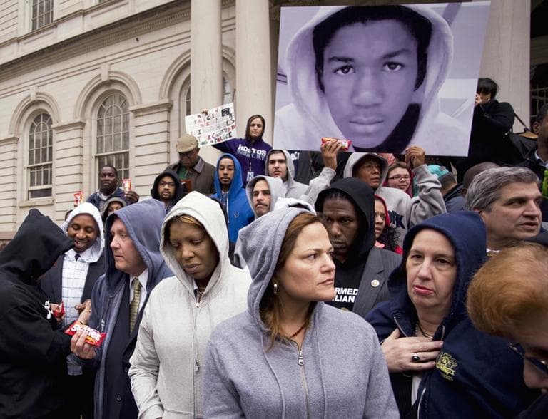 In this photo provided by New York City Council, council members gather on the steps of New York&#039;s City Hall March 28, under a photo of Trayvon Martin, the unarmed Florida teenager who was shot by a neighborhood watch volunteer. (AP)