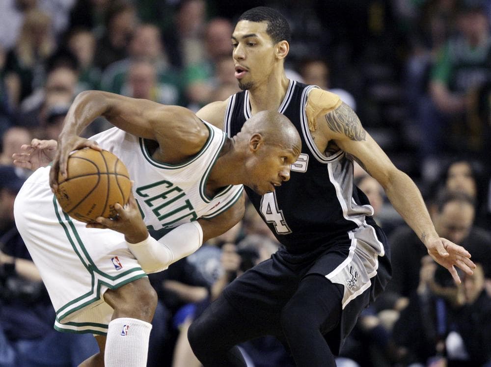 Celtics guard Ray Allen (20) looks to make a move with the ball against San Antonio Spurs guard Daniel Green (4) during the first half of last night&#039;s home game. (AP)