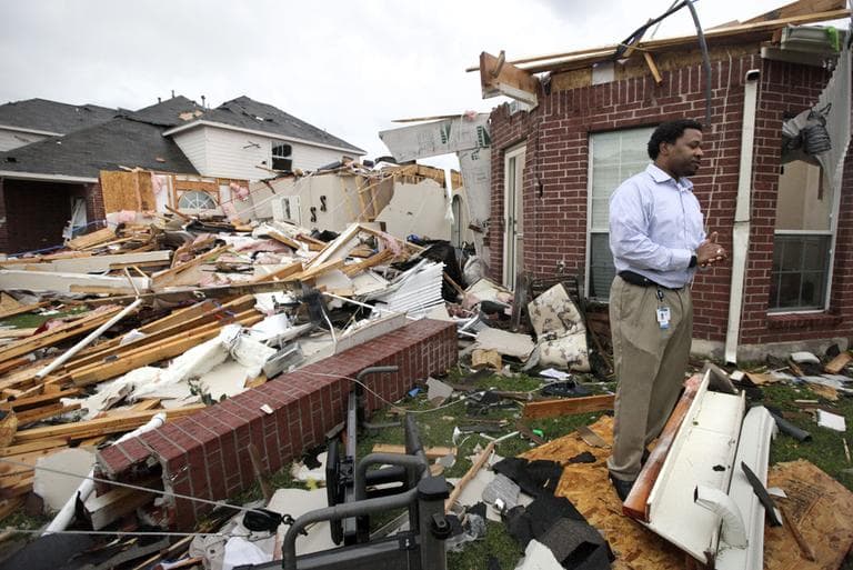 Homeowner Chris Wilson pauses among what remains of his home after a tornado swept through the area Tuesday in Forney, Texas. Wilson said no one was home when the tornado came through and he plans to rebuild his home. (AP)