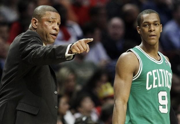 Celtics head coach Doc Rivers points as he talks to guard Rajon Rondo during the first half Thursday in Chicago. (AP)